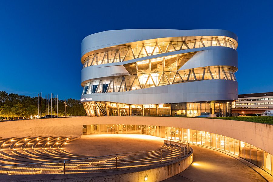 Stuttgart’s Mercedes-Benz Museum, lit up at night.